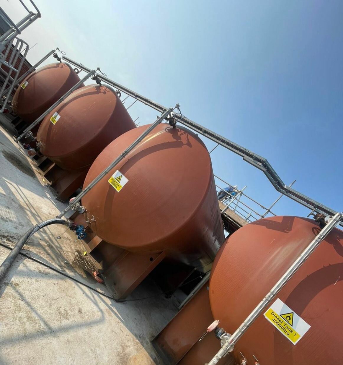 Four commercial fuel tanks